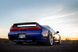 blue car with nice sunset in background