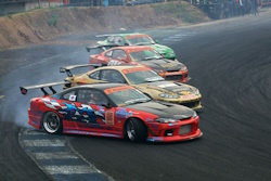 Four cars drifting and 3 are the same type of car