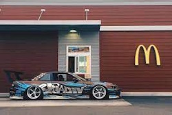 s13 with massive spoiler infornt of mcdonalds